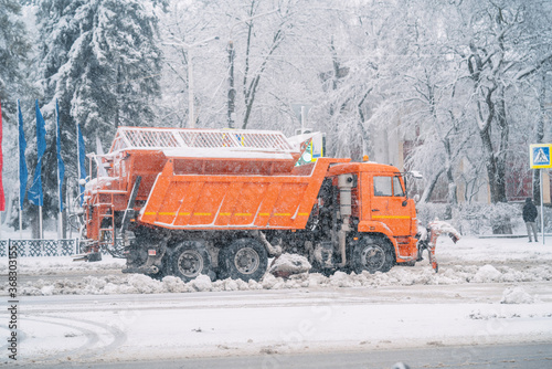 Snowplow cleans the road from snow