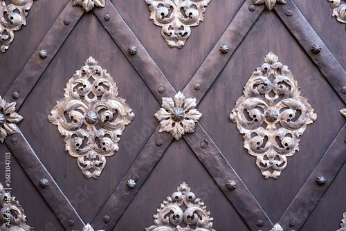 Ornate exterior door decorations in Prague, Czech Republic.