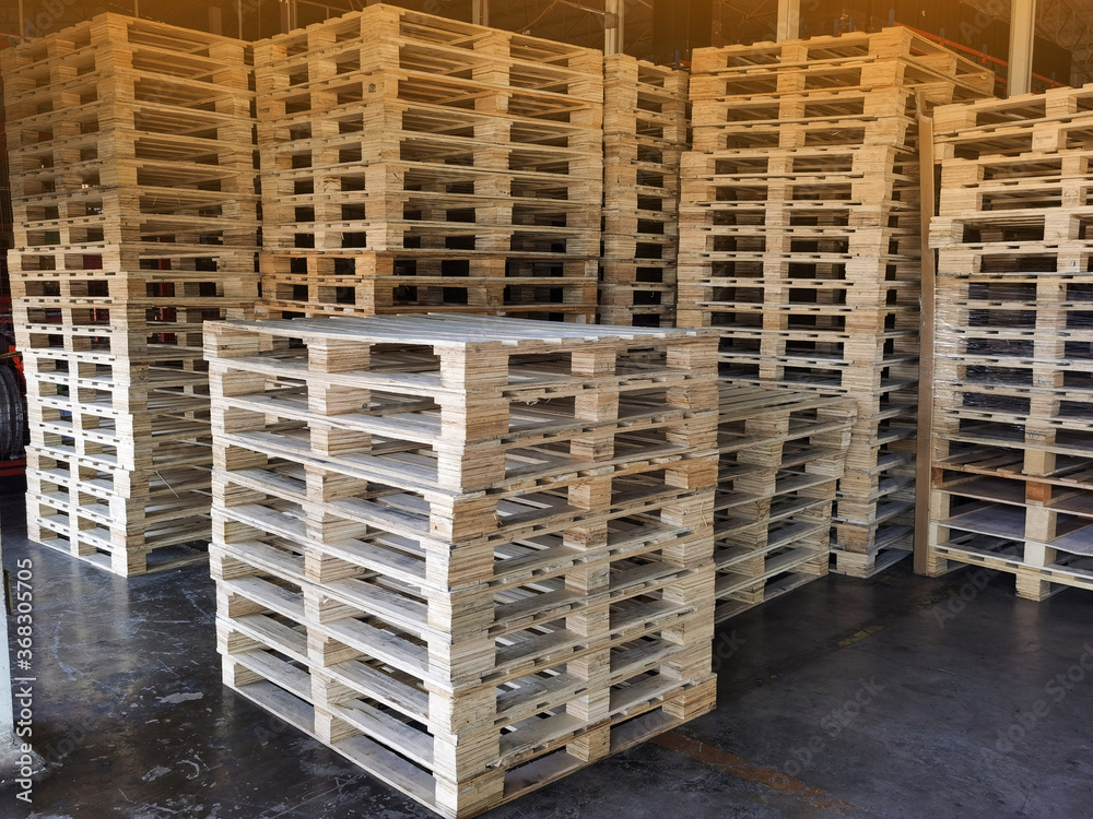 Wooden pallets stack at the freight cargo warehouse for transportation and logistics industrial Wooden pallets stack at the freight cargo warehouse for transportation and logistics industrial