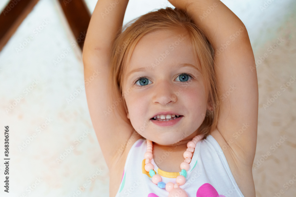 Portrait of a little blonde girl looking at camera Portrait of a little blonde girl looking at camera