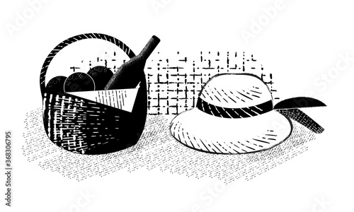 Wine and fruit in a basket and a hat. Attributes of a picnic, lunch in nature in a retro style.