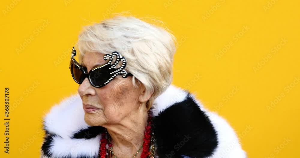 Funny grandmother lifestyle moments on colored background Funny grandmother lifestyle moments on colored background