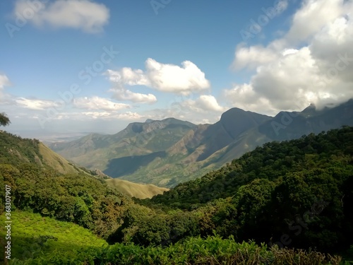 Beautiful landscape of tea plantation in the Indian state of Kerala with selective focus. landscape of the city, Munnar with its tea planatation, valley and Nilgiri mountain ranges.