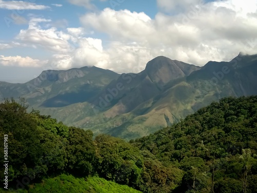 Beautiful landscape of tea plantation in the Indian state of Kerala with selective focus. landscape of the city, Munnar with its tea planatation, valley and Nilgiri mountain ranges.
