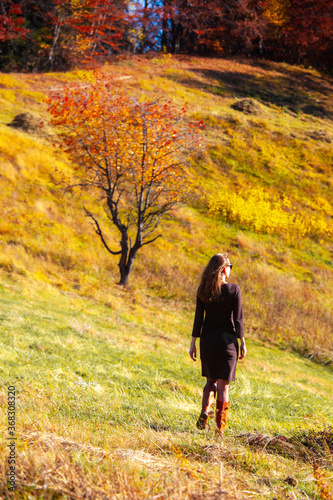 woman girl autumn forest ray sunlight red yellow deep sun © NataliAlba