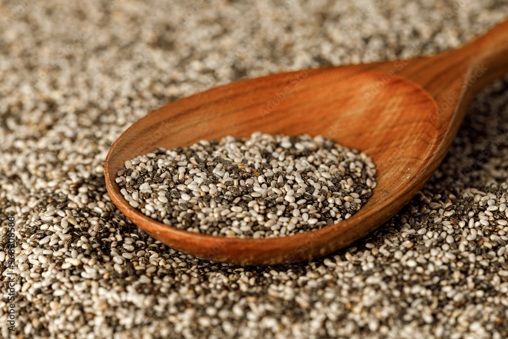 Wooden spoon with chia seeds close up Wooden spoon with chia seeds close up