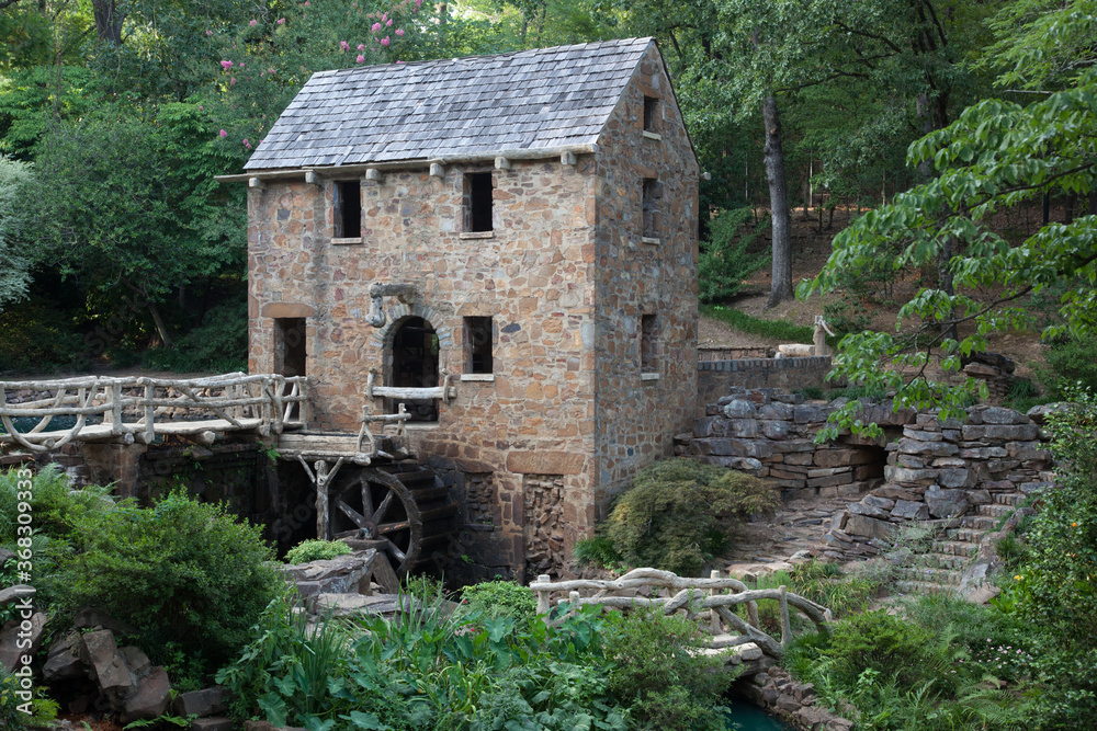 Old Stone grist mill with a mill wheel