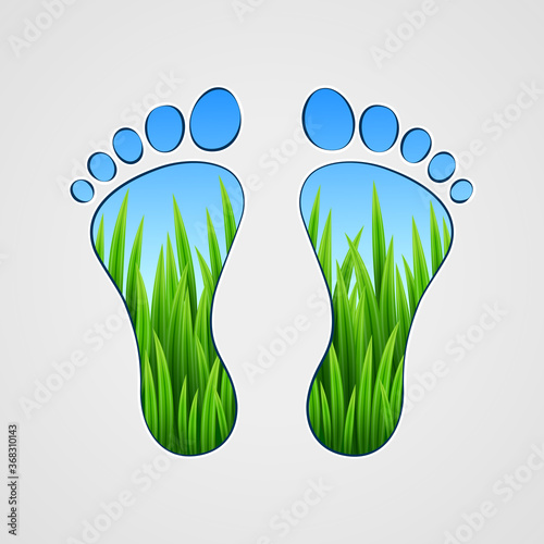 Silhouette of human footprints with grass inside