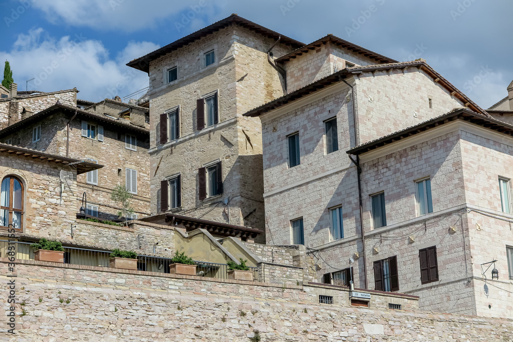 Ancient building made of stone in the medieval city of Assisi, Umbria region, Perugia province, Italy