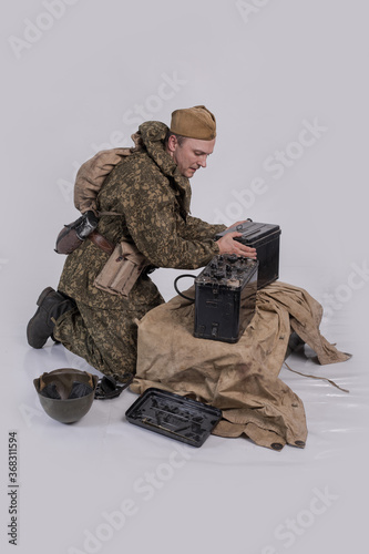 Fototapet Male actor in the historical uniform of an officer of the Soviet Army with an in