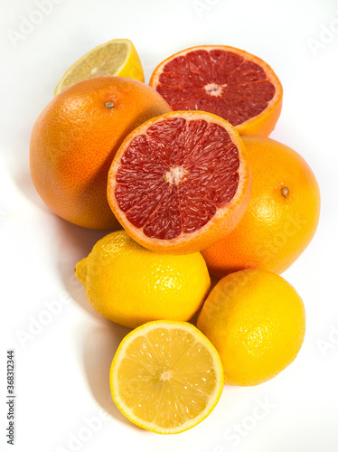Lemons and grapefruits on a white background.