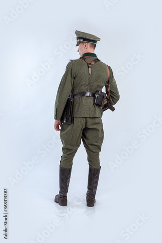 Male actor reenactor in historical uniform as an officer of the German Army during World War II