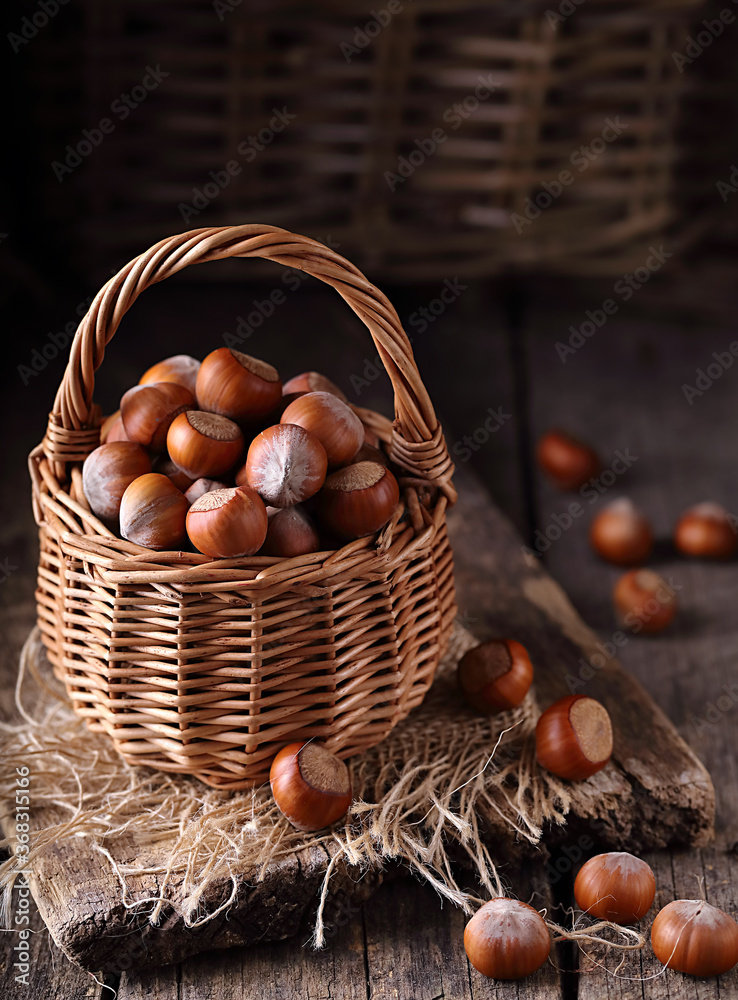 Hazelnuts in a basket on a wooden table. Hazelnuts in a basket on a wooden table.