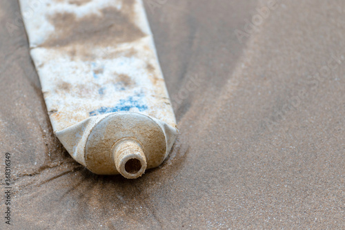 toothpaste cover dumped into the ocean pollute Matara beach photo