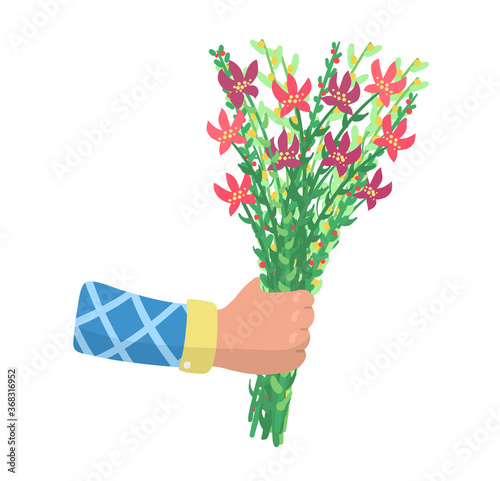 Male hand hold spring blossom flower, male arm give present bouquet pick fiel...