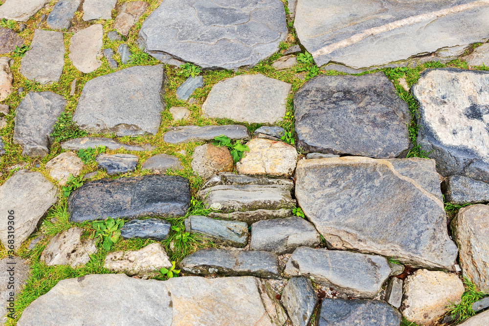 Obraz premium Urban stone paving. Texture, background, selective focus