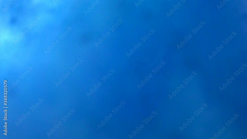 Blue powder / dust explosions background texture in slow motion shot at 960fps
