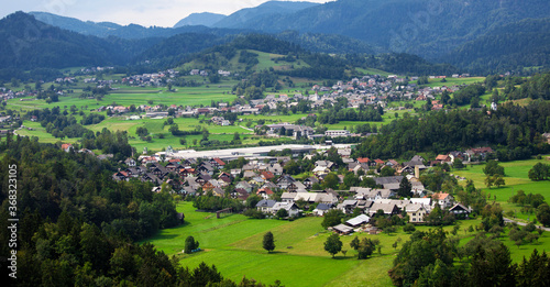 Mountain valley with green trees and houses