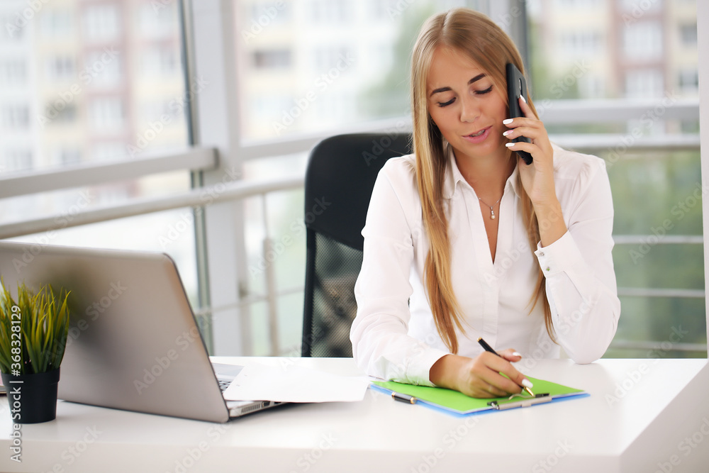 Modern business woman in the office blonde