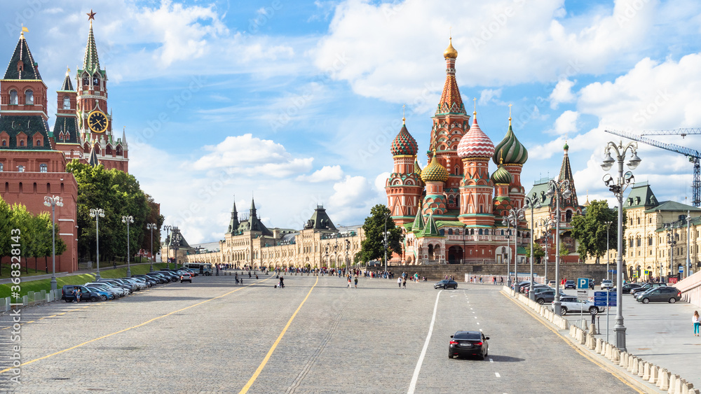 panoramic view of Red Square from Vasilevsky Spusk (Descent) during city sightseeing tour on excursion bus in Moscow city on sunny summer day