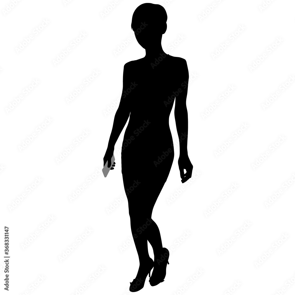 silhouette of a slender girl with a phone in hand