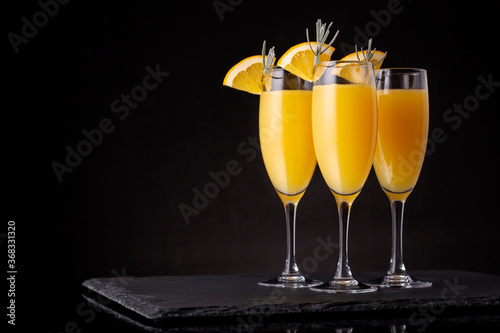 Mimosa cocktails in champagne glasses