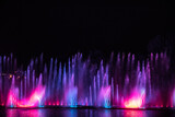 Musical multimedia fountain with colorful lights at night. Ukraine, Vinnitsa