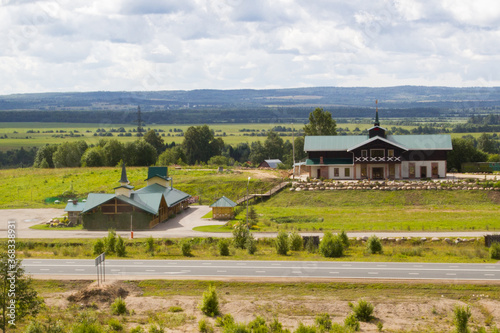 roadside hotel in the middle of a green field