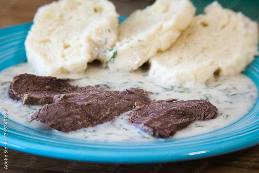 Dill sauce with beef and yeast dumpling
