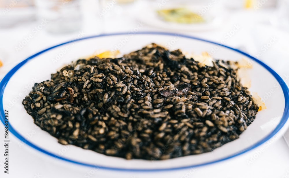 Black rice dish in a restaurant. Black rice dish in a restaurant.