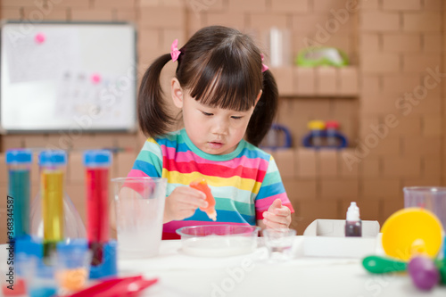 young girl play science experiments for homeschooling