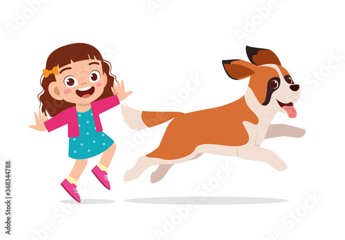 happy cute little kid boy girl play with pet dog