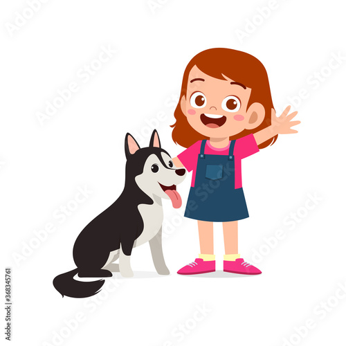 happy cute little kid boy girl play with pet dog