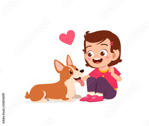 happy cute little kid boy girl play with pet dog