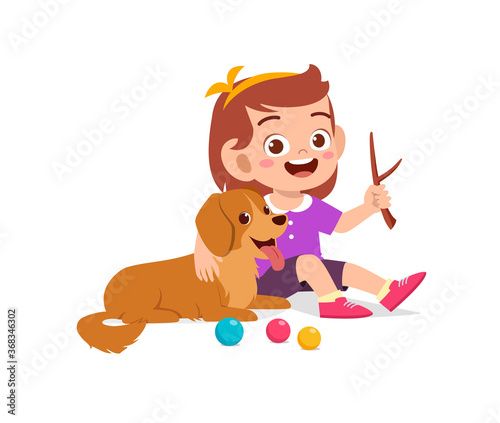 happy cute little kid boy girl play with pet dog