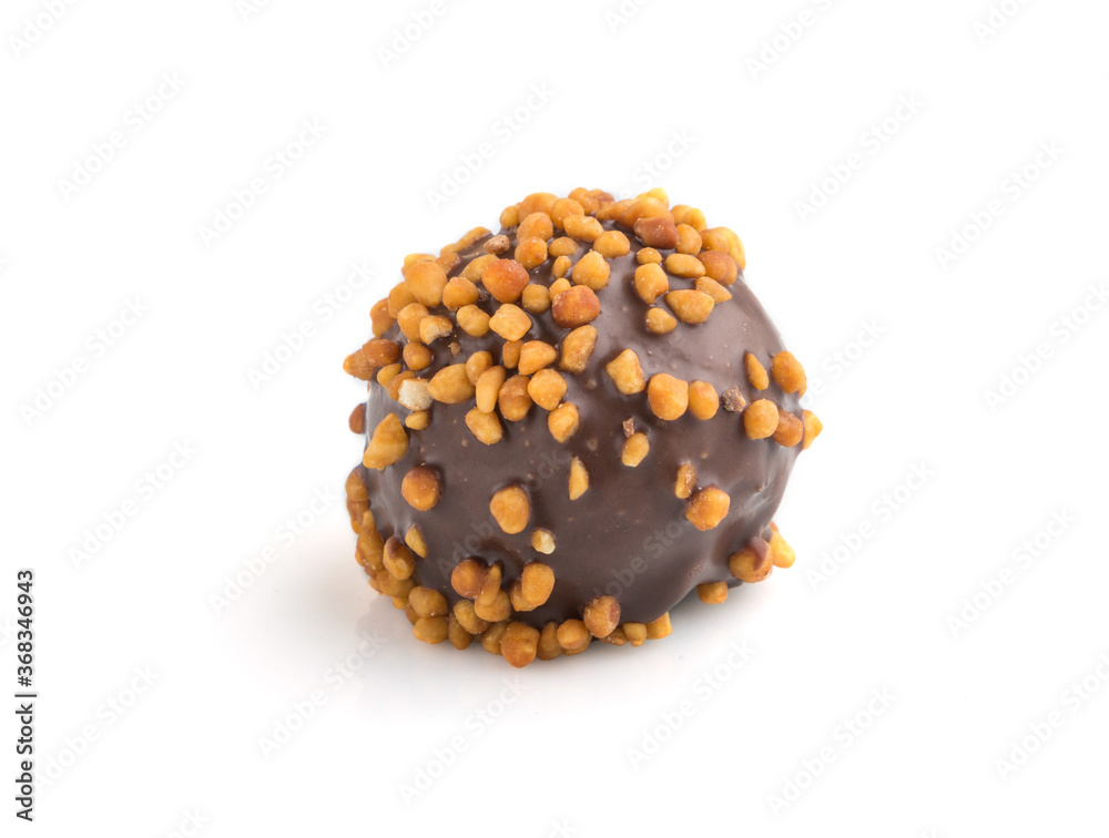 Chocolate caramel ball candy with almonds isolated on white background. Side view. Chocolate caramel ball candy with almonds isolated on white background. Side view.