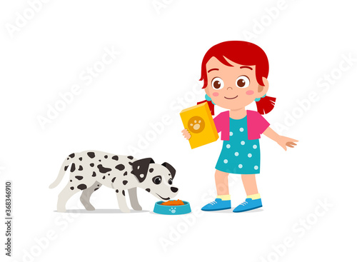 happy cute little kid boy girl play with pet dog