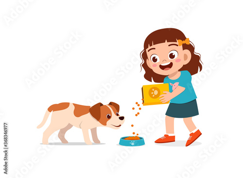 happy cute little kid boy girl play with pet dog