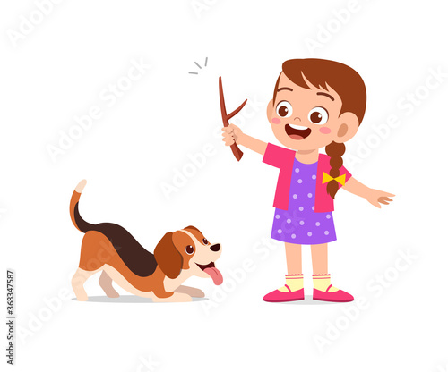 happy cute little kid boy girl play with pet dog