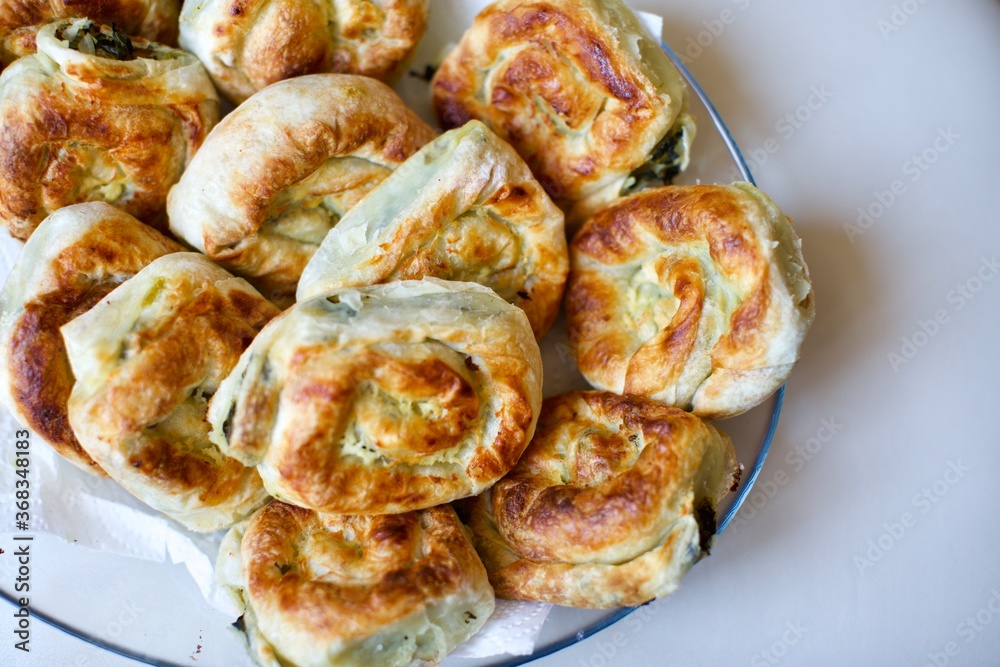 Home made donut pie with spinach and cheese. It is the most famous food of the Mediterranean. Vegan food. 