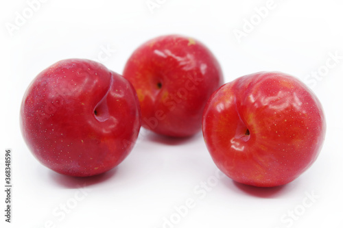 Plums isolated on a white background. Fresh plum. Closeup