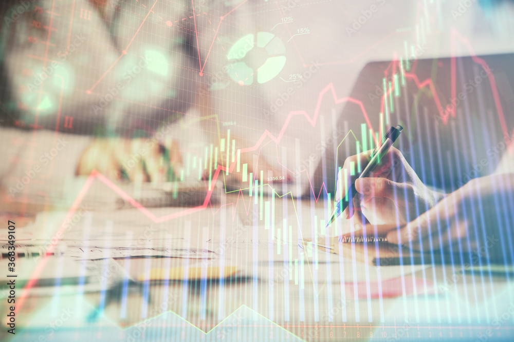 Multi exposure of woman hands typing on computer and forex chart hologram drawing. Stock market analysis concept.