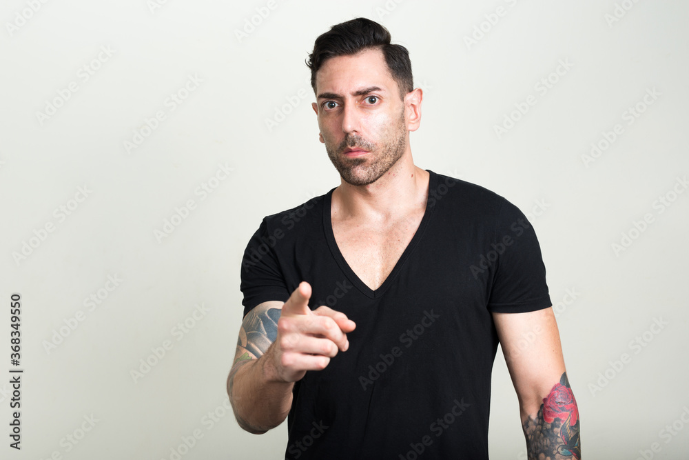 Portrait of handsome bearded man as rebel