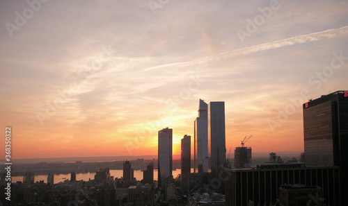 sunset cityscape of manhattan and skyline of NJ © mimilee