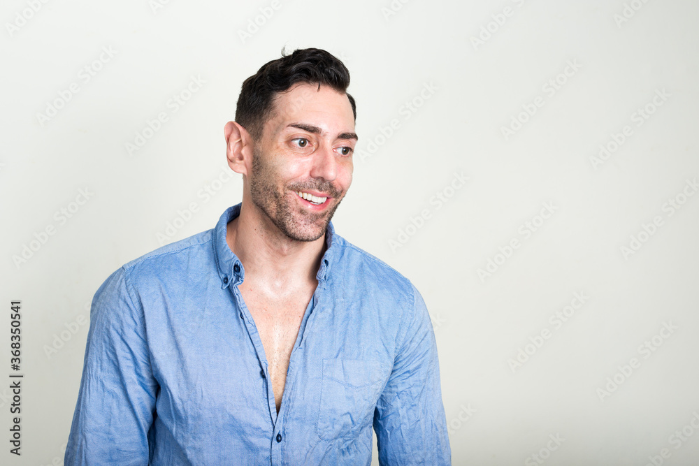 Portrait of happy handsome businessman with beard stubble Portrait of happy handsome businessman with beard stubble