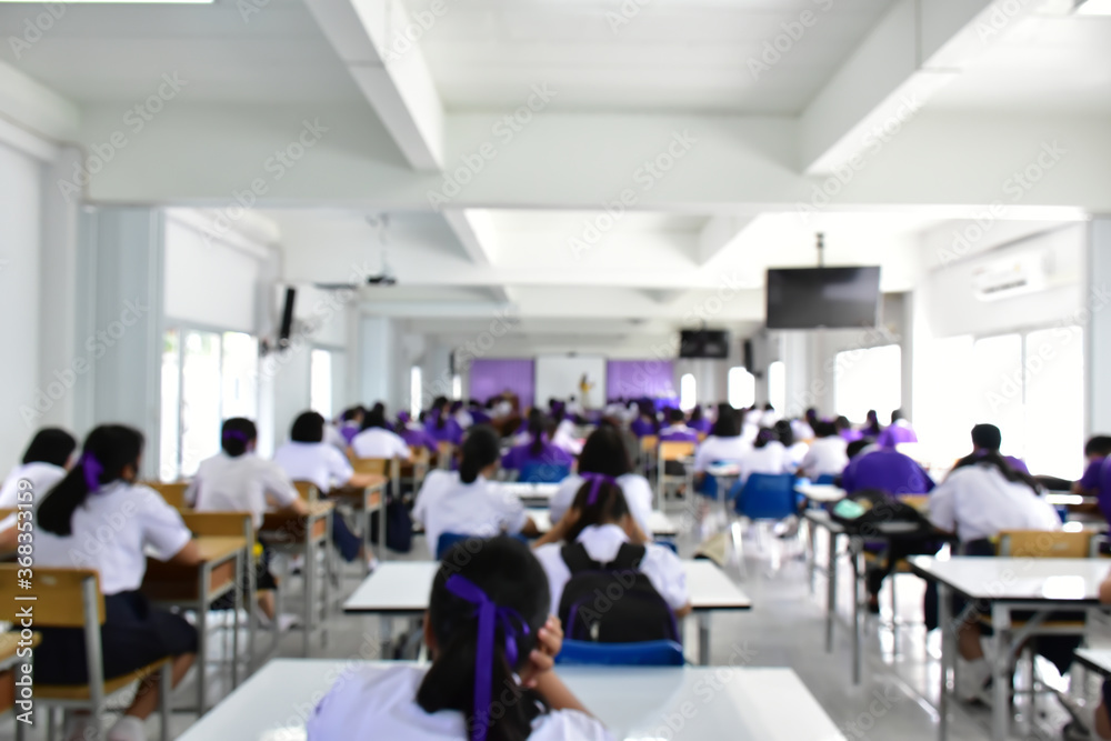 Blurred background of big classroom.