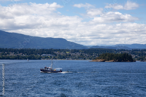 Boat in the Ocean by the City of Nanaimo during a sunny summer day. Taken in Vancouver Island, British Columbia, Canada.