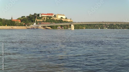 Danube river and Varadin bridge in Novi Sad, Serbia. Petrovaradin fortress is in the background. photo