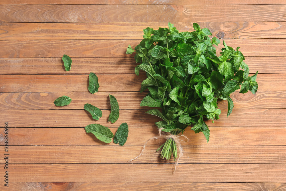 Fresh green mint on wooden background Fresh green mint on wooden background