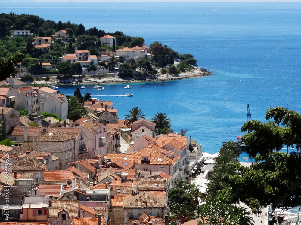 Aerial view of Hvar old city with port, old town, and island in Croatia. Hvar is a famous Croatian island for vacation.